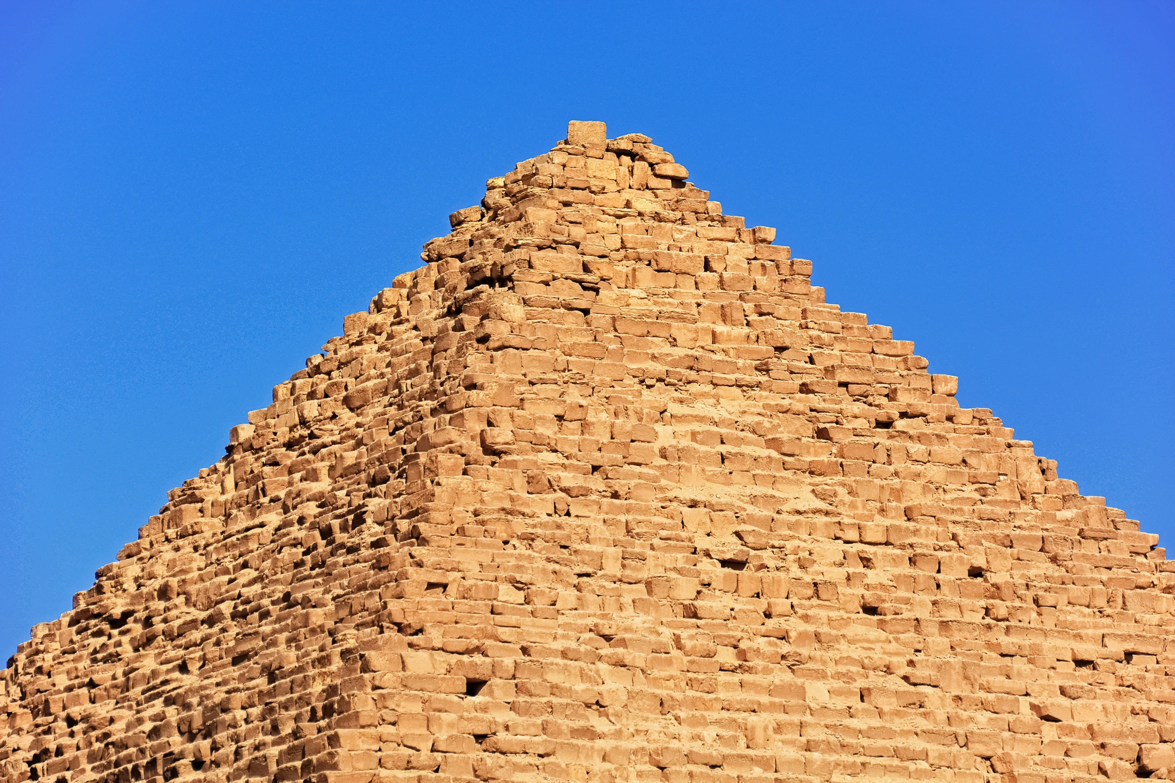 pyramid like structure of egyptian building with sky in background