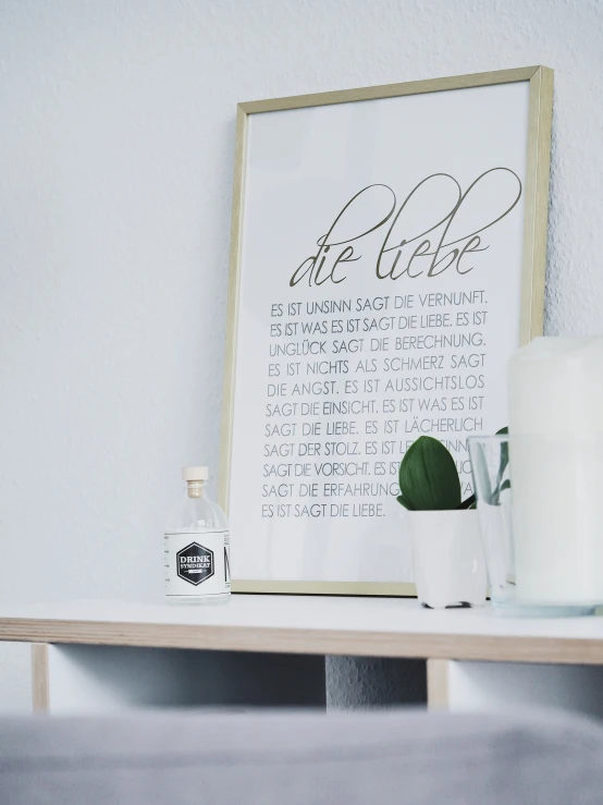 some candles and bottles sit on a table