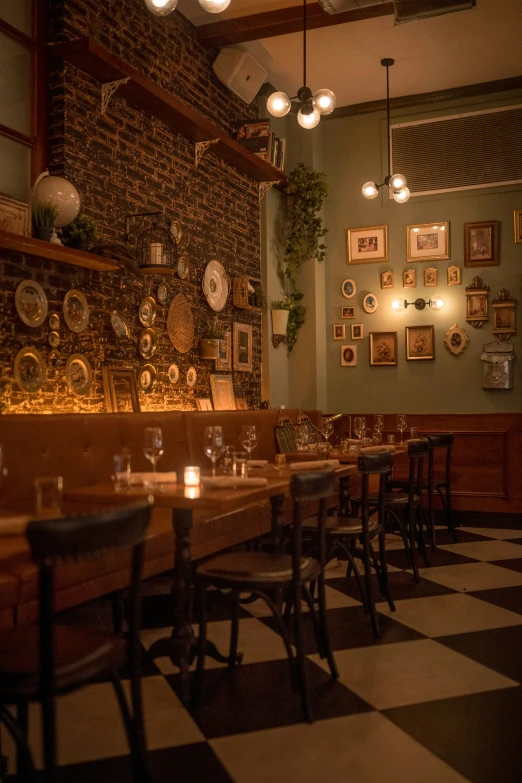 several tables and chairs in a dimly lit restaurant