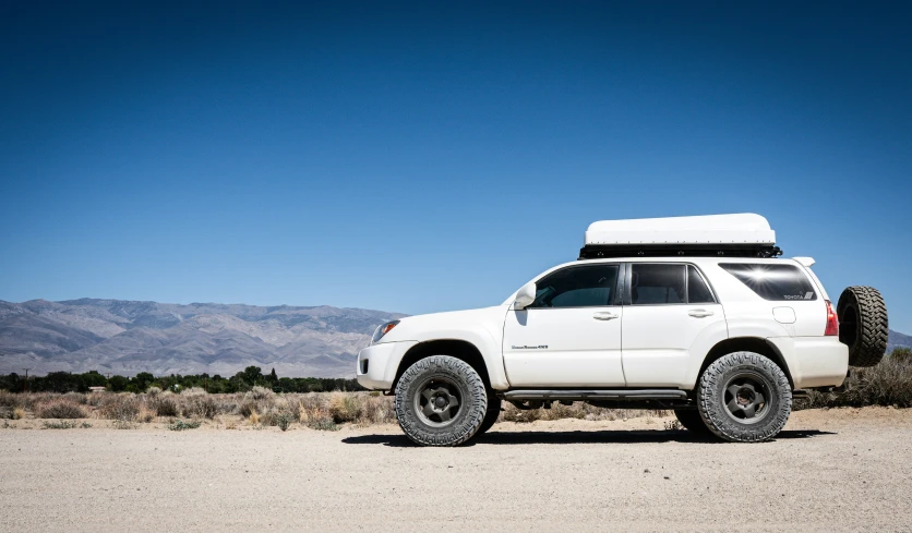 a big wheel on a big truck in the desert