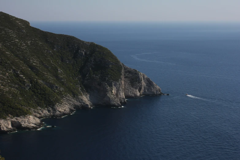 boat moving on the water between two mountains