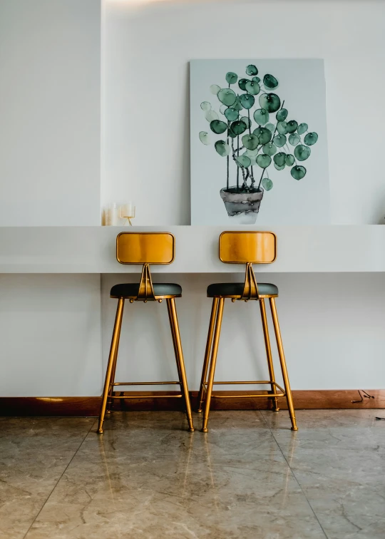 the two stools in the room have been decorated with flowers