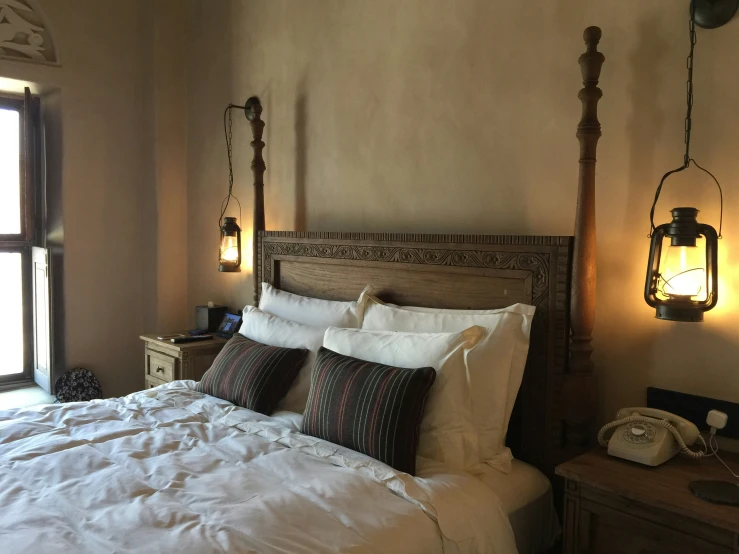 a el room has an old fashioned style bed