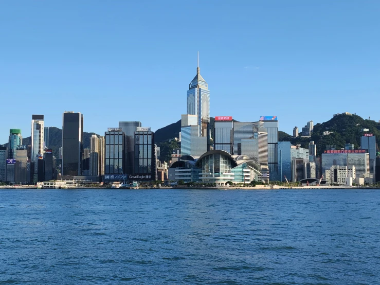 a skyline view of the city skyline, in the background, is seen from the ocean