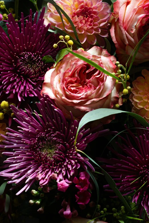 a vase with flowers in it on a table