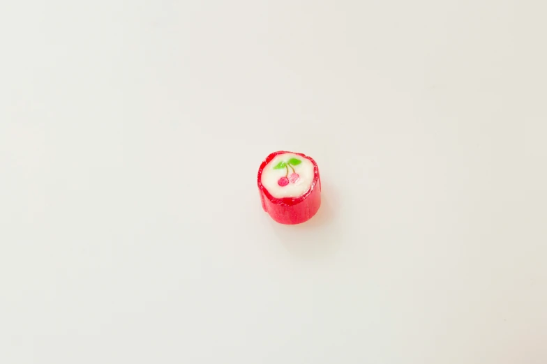 a tiny piece of food on a white surface