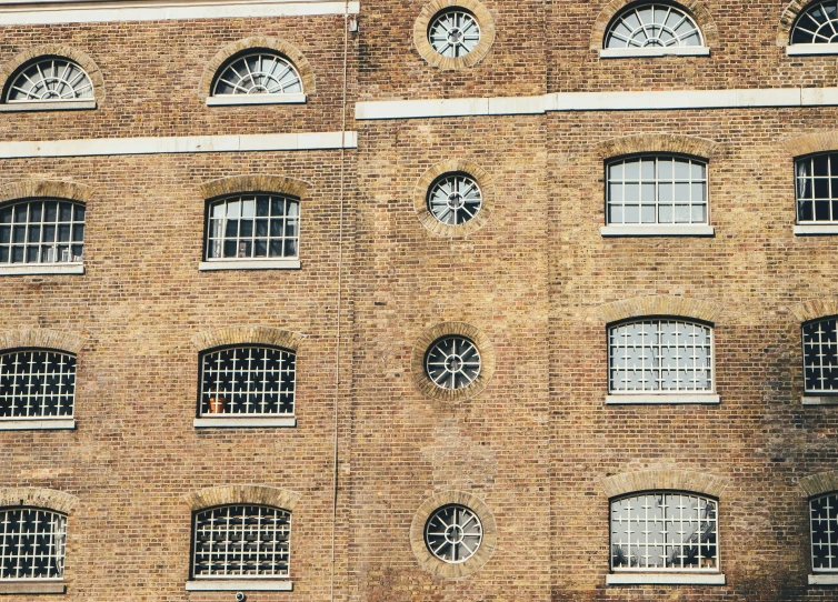 a large brick building with many windows on the front