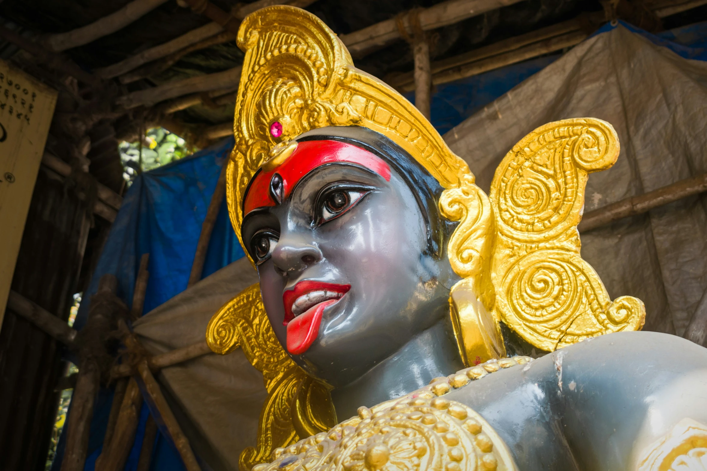 an artistic statue of a demon wearing a helmet