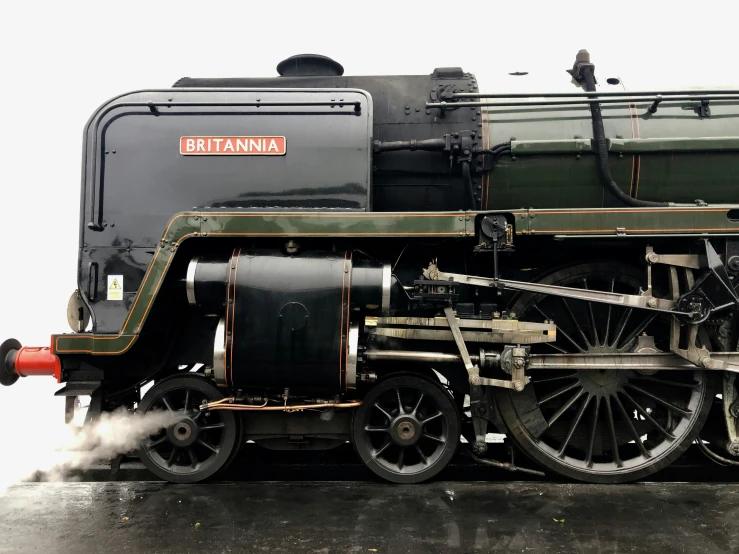 a steam train with the wheels spinning on it