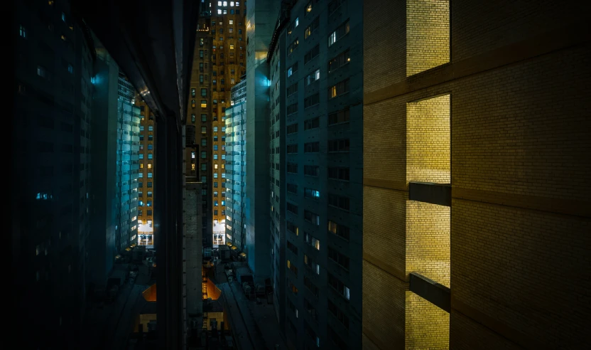 view down a narrow city street at night