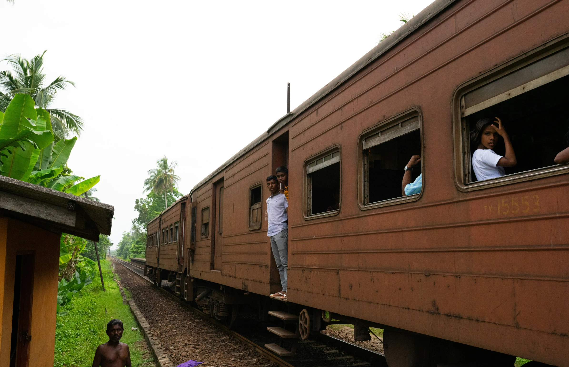 some people that are standing on the train