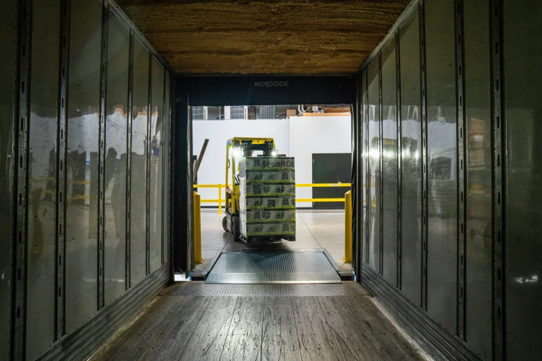 the door to a warehouse is open showing several stacks of boxes