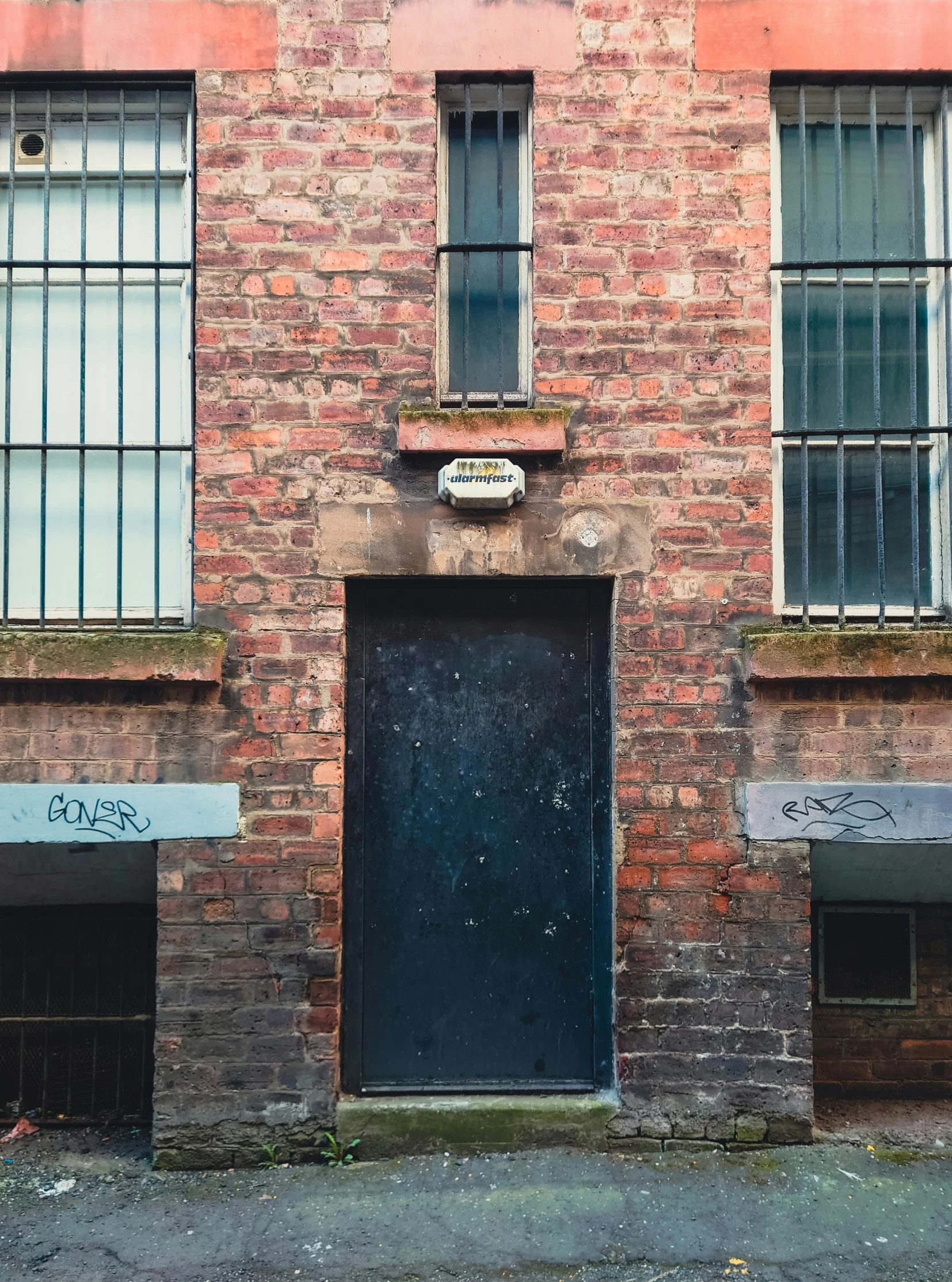 there is a very old building with a door and window