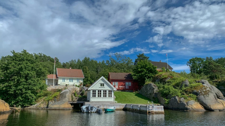 the small cabin is on the dock by the water