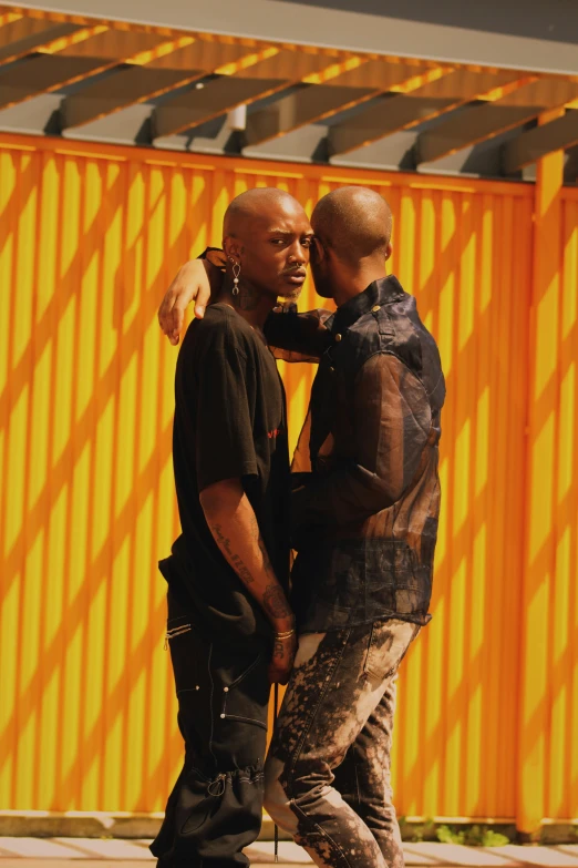 two men walking down the street with a bright background