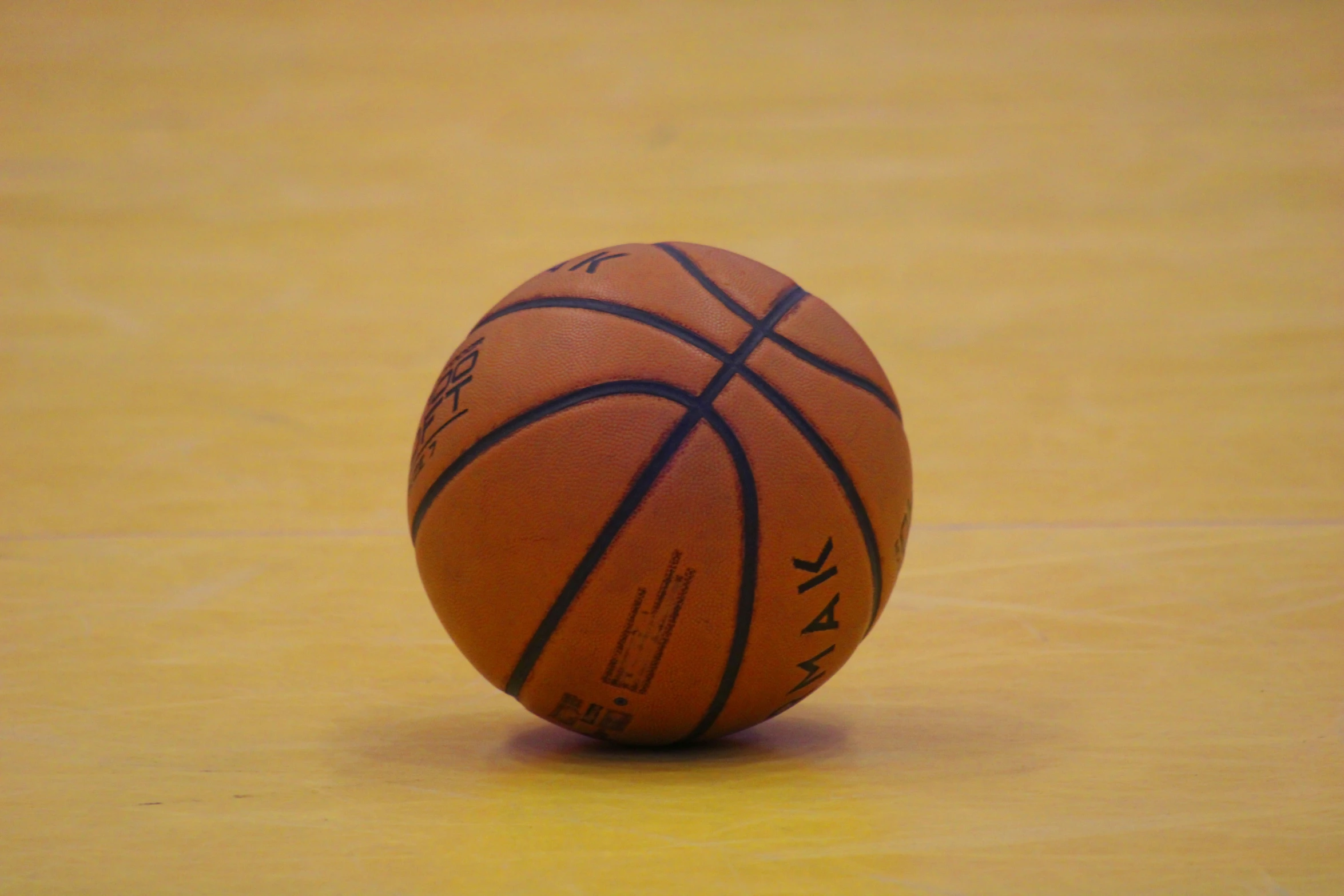 a basketball sits on the court for the basketball