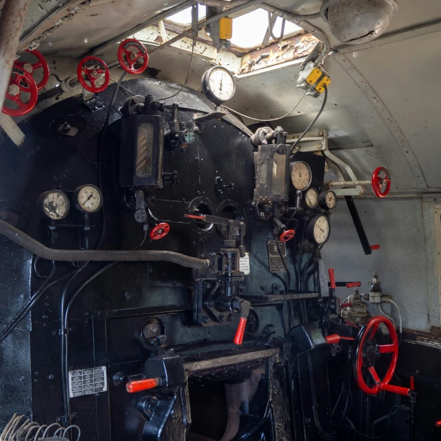 an old locomotive with dial controls and gauges