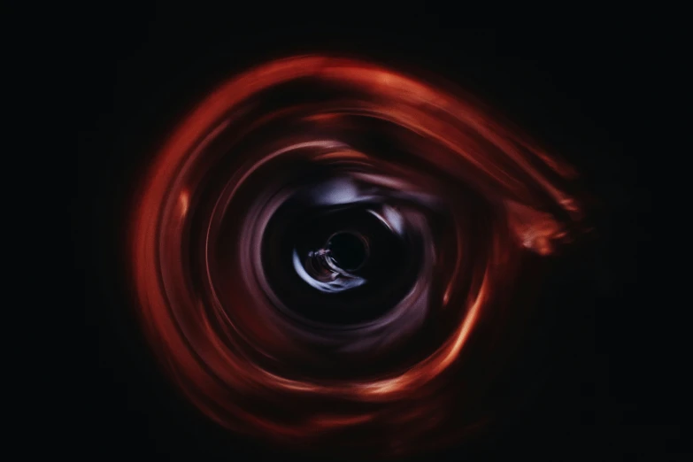 an artistic and very large red swirl is on the screen