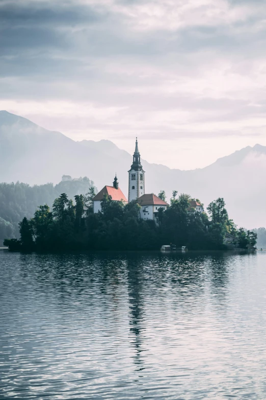 a small island is in the middle of a lake