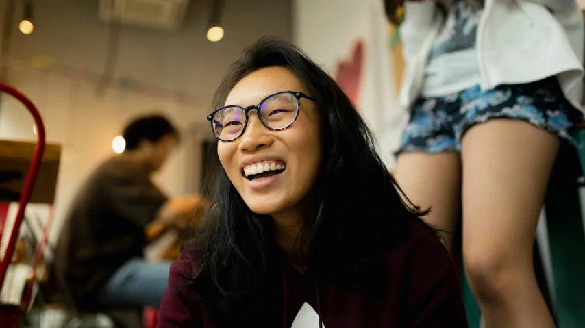 a close up of a person with glasses