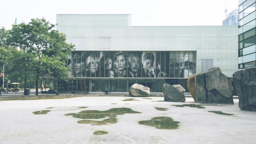 a picture of some rocks in front of a building