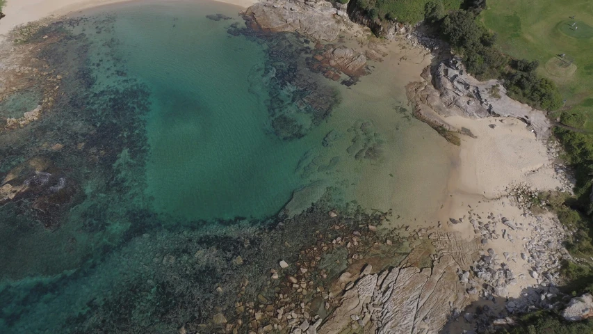 a wide view of some water next to a shore