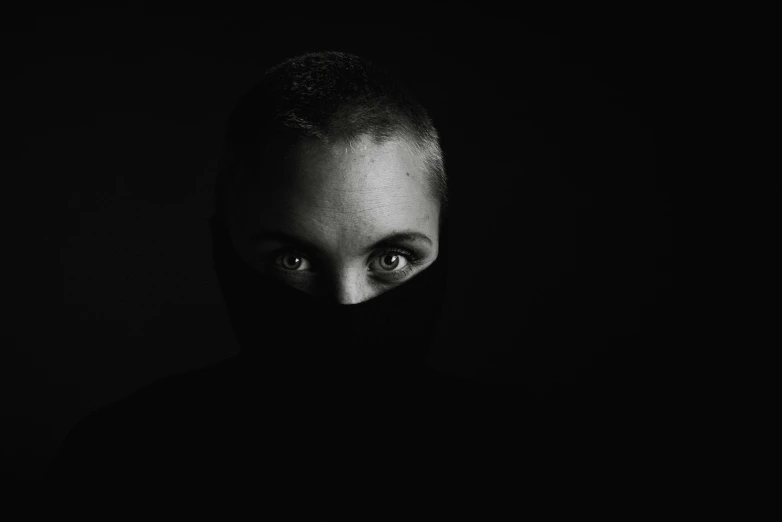 a woman wearing black cloth on her head