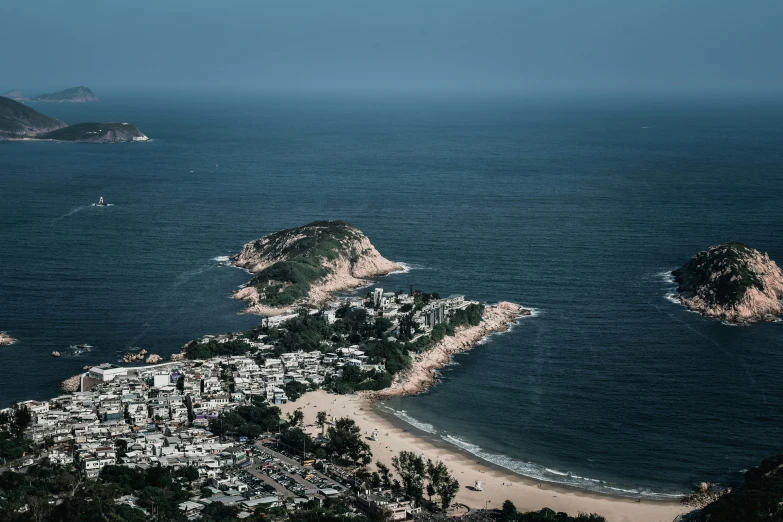 aerial view of an ocean with small town near the shoreline