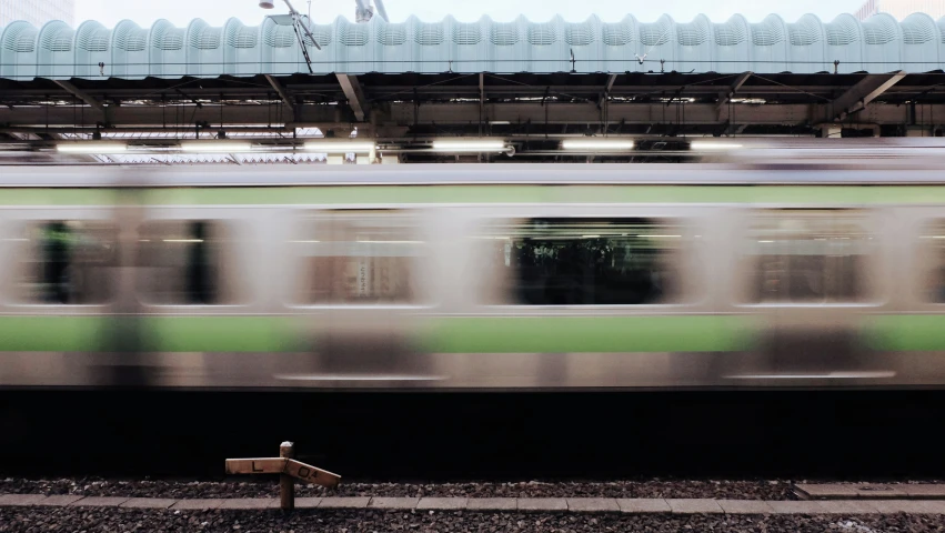 there is a train moving in the subway