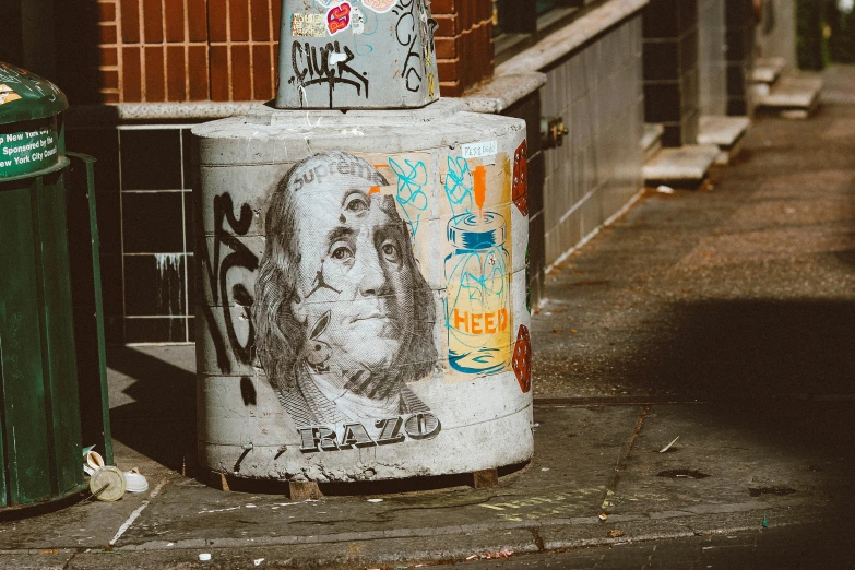 a cement pillar with graffiti painted on it