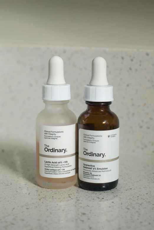 two bottles of ordinary or similar medicine are sitting on the counter