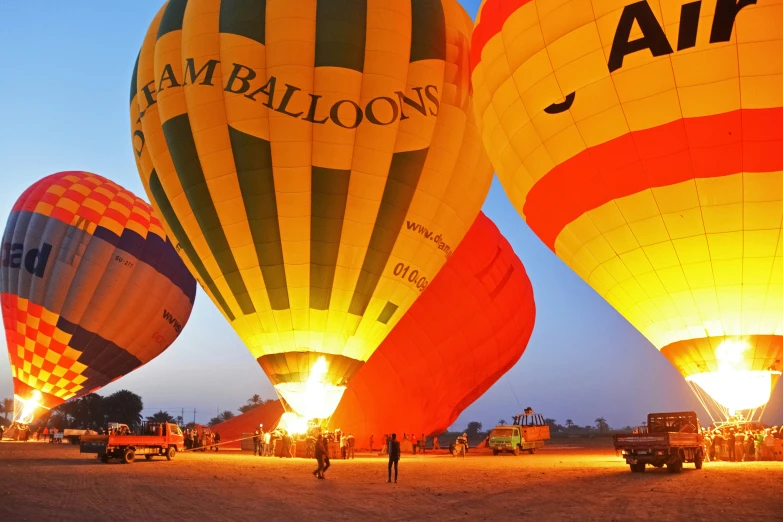 a number of  air balloons floating in the sky