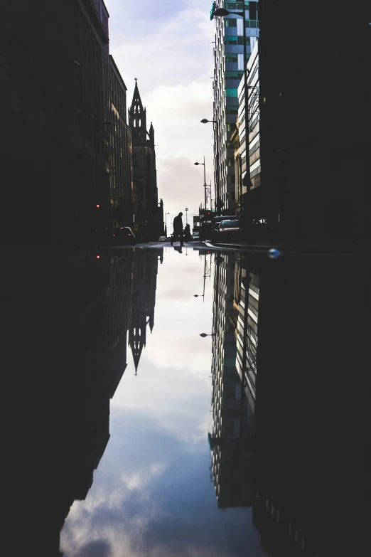 a tall building sitting next to other tall buildings