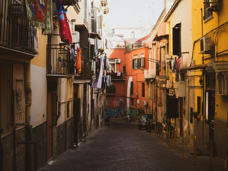 an alleyway with laundry hanging out to dry