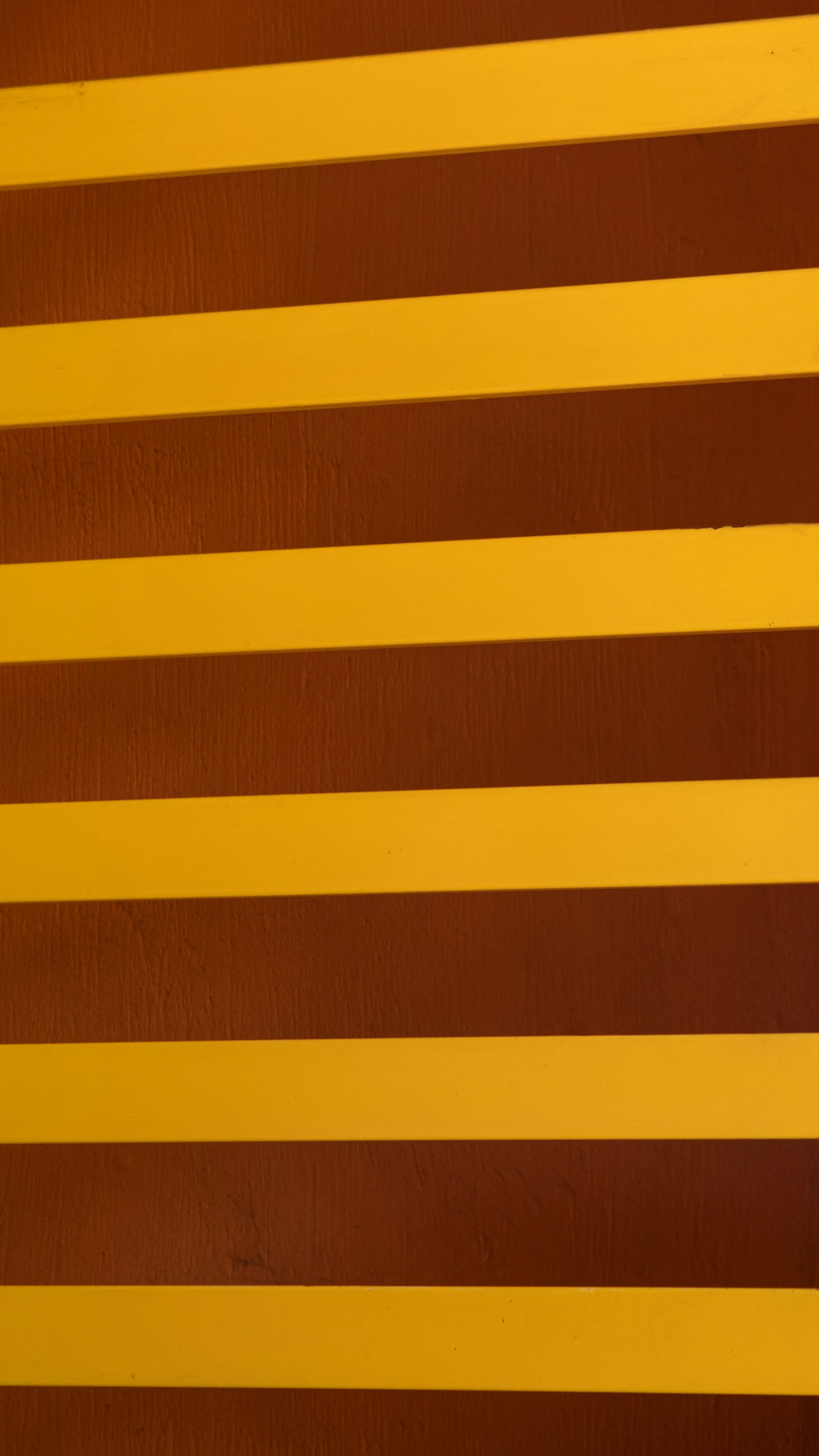 brown and yellow stripes are in an abstract pattern