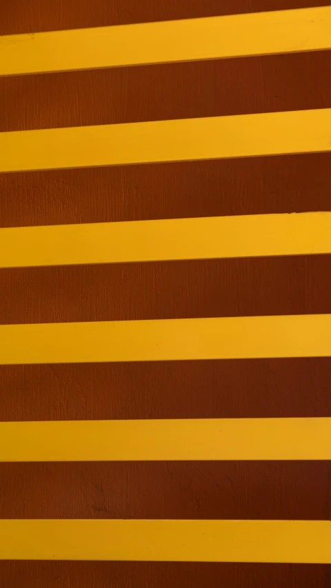 brown and yellow stripes are in an abstract pattern