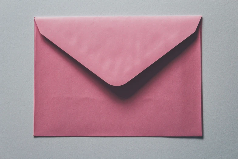a pink envelope in pink colored paper