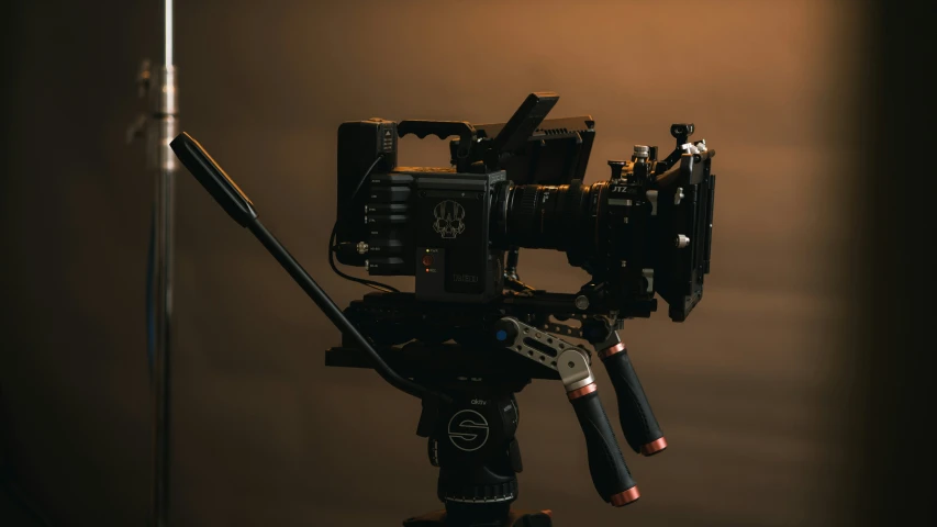 a camera being attached to an object in a darkened room