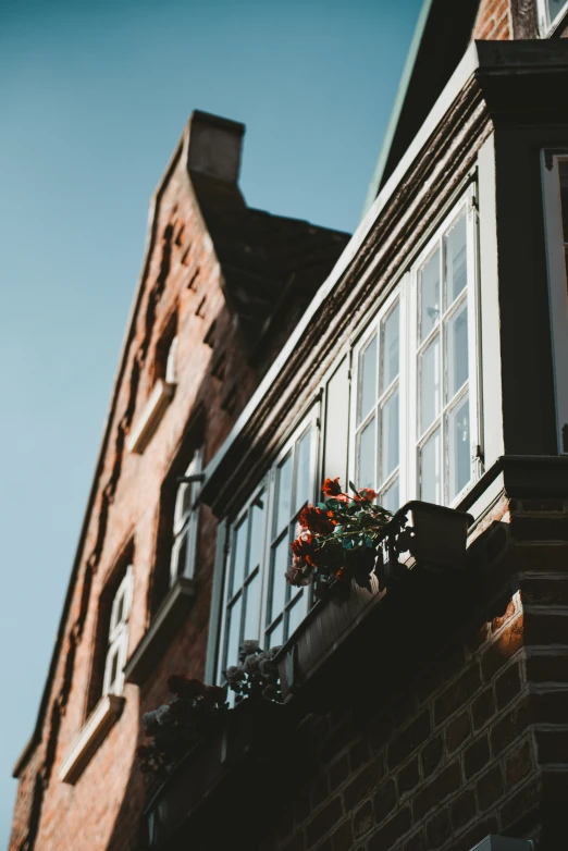 windows on the side of an old brick building