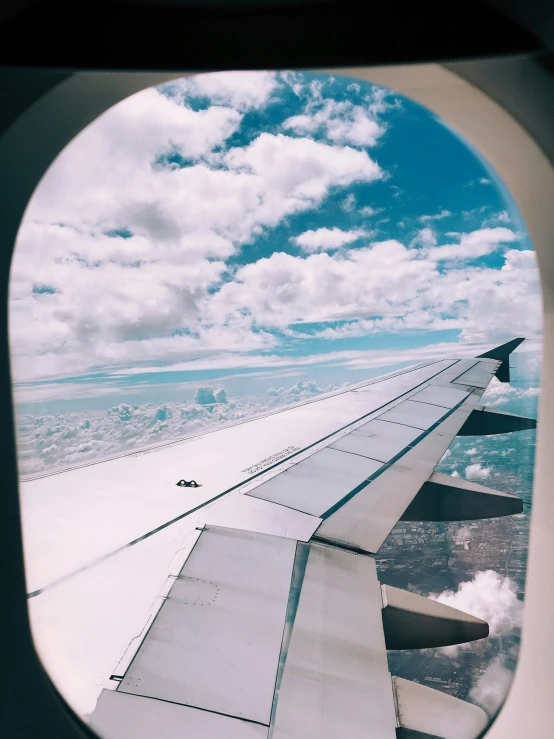the wing and wing view from inside an airplane