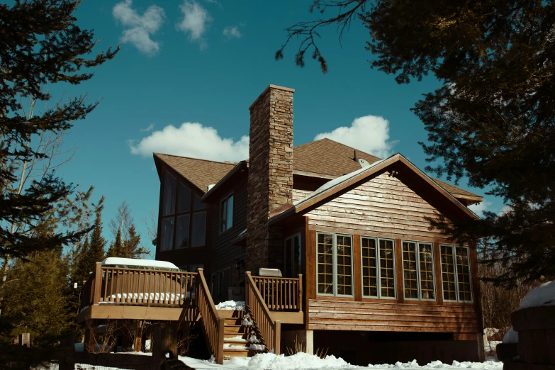 an ornate wooden house with a tall chimney