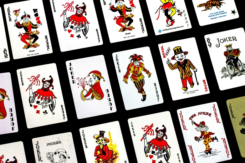 a set of playing cards in different colors and designs