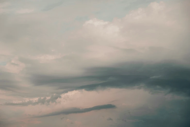 two airplanes flying in a cloudy sky