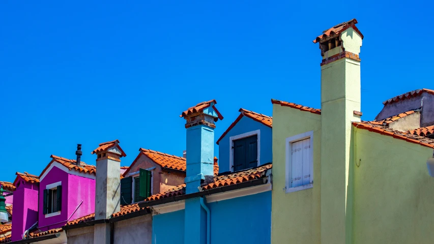 colorful houses line the rooftops of an urban area