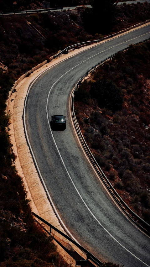 two cars on a road with no other vehicles