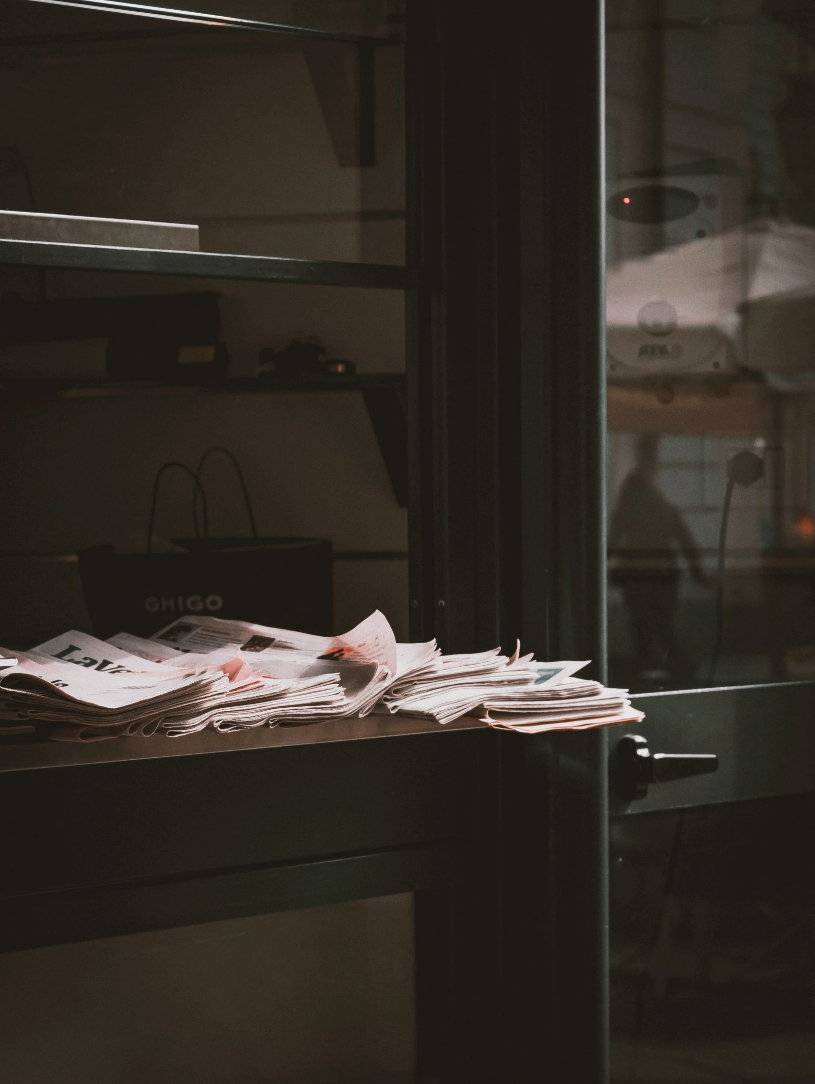 several stacks of newspaper sit next to each other