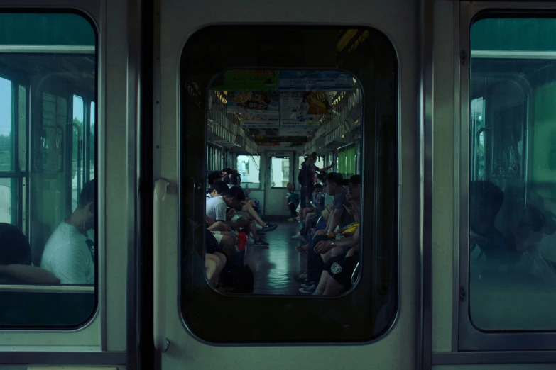 the inside of a subway train full of people