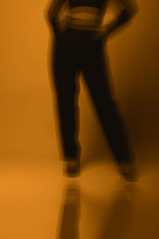 a man in an orange room with his back to the camera