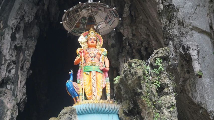 an elaborate statue at the entrance to a cave