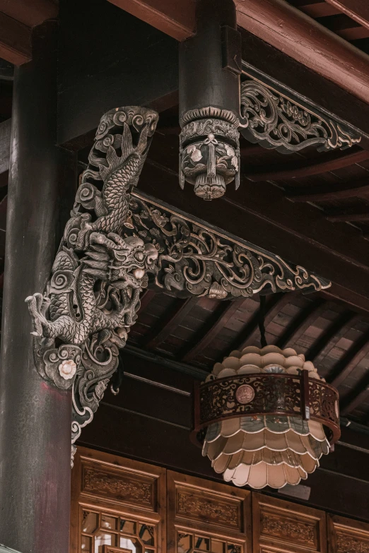 a large oriental style chandelier hanging from a ceiling